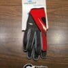 A pair of gloves in red and black color kept on a table